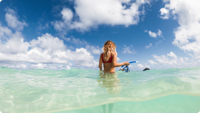 underwater shot of woman enjoying the water in hawaii